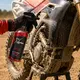 The process of quickly cleaning and refreshing an off-road motorcycle surface using Xzone Dirt Finisher.